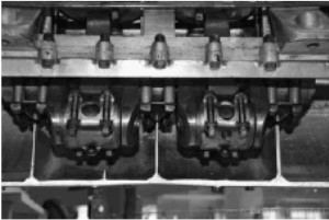 The open crankcase shows the connecting rods