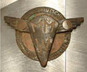 Mittel Deutsche Motorwerken logo on an engine