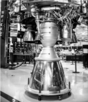 Merlin 1D engine, behind a cluster of Merlins