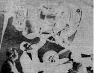 Personnel looking at the onboard Boeing 502 engine
